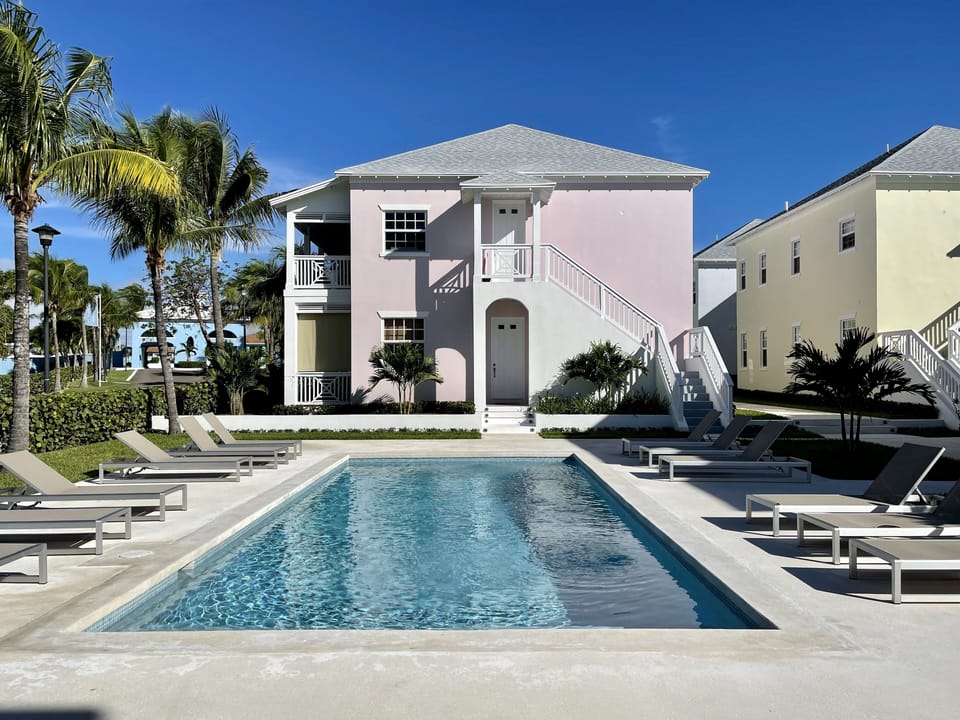 Exterior view of the Condo (ground floor), pink building.
