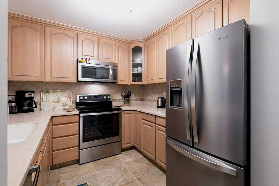 Cook with style in this modern kitchen featuring premium appliances and everything needed for meals at home.