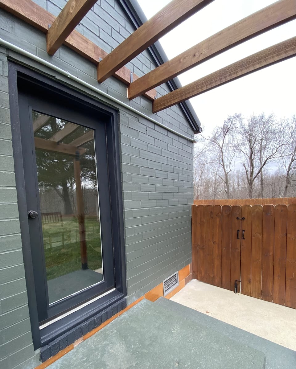 Easy backyard access is just three steps from the door to the gate.