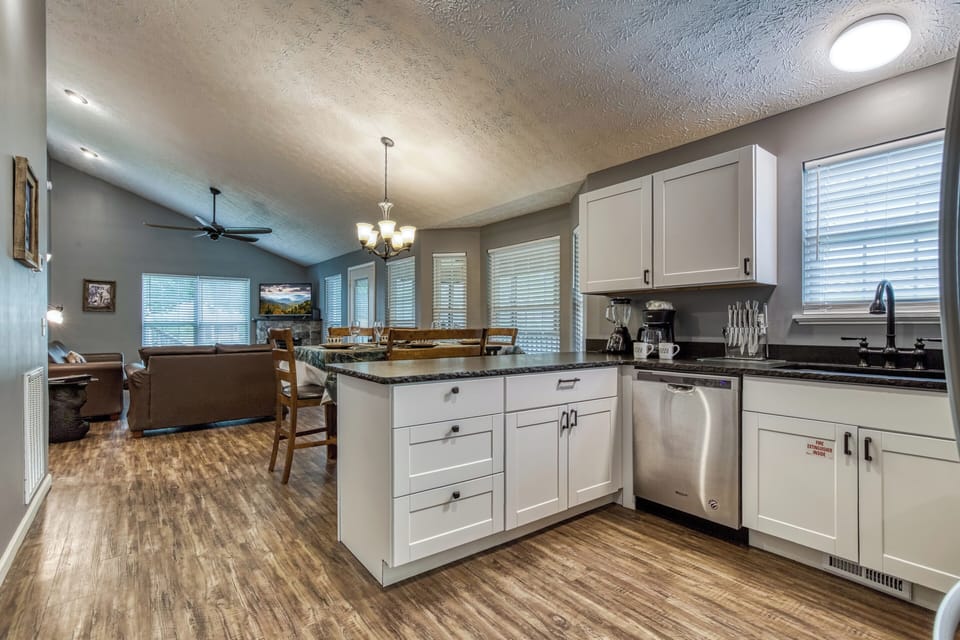 Smoky Mountain Vacation Rental "Wolff Lodge" - Bar top, living room and dining room
