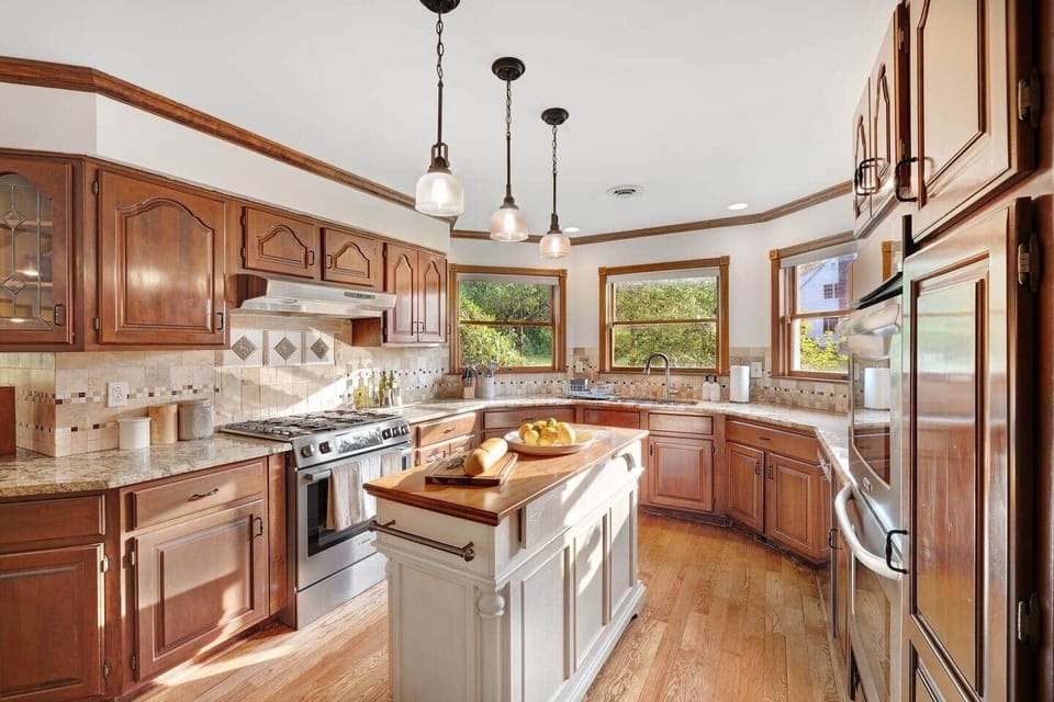 Gather around the large island in this warm and inviting kitchen, designed for sharing meals and making memories. With plenty of space to cook and connect, the chef’s kitchen is tastefully styled and features top-brand appliances.
