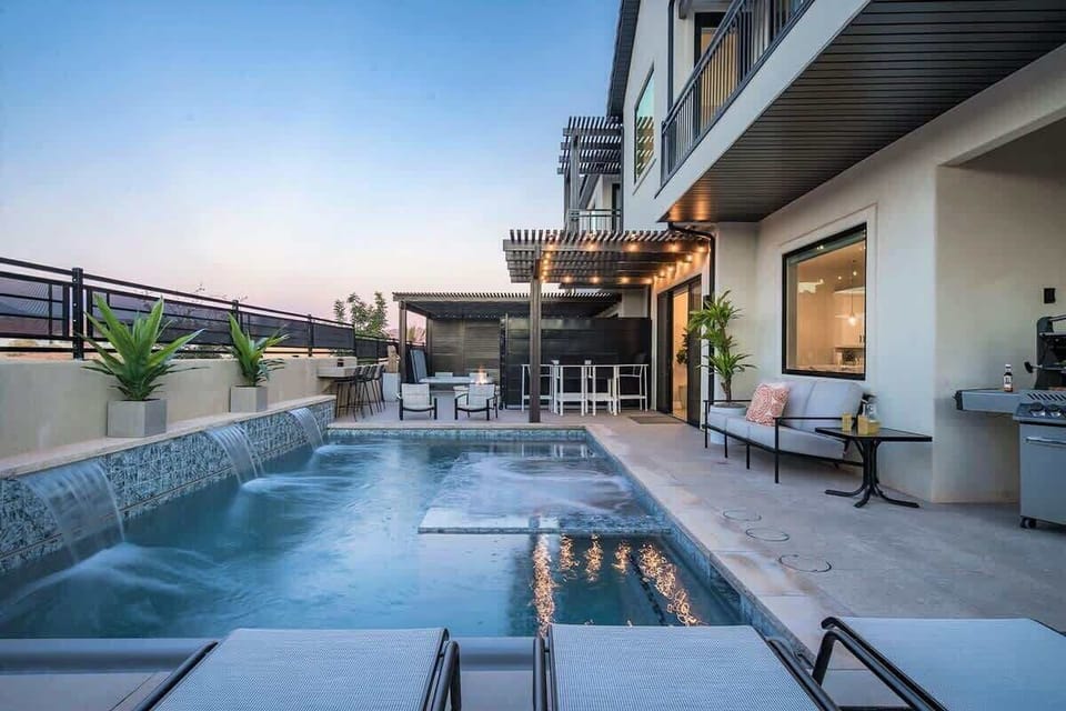 Enjoy private pool and hot tub with fire pit and dining areas