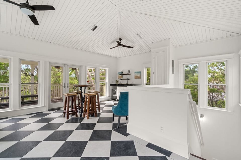 3rd floor Bonus Room with bistro table and four chairs