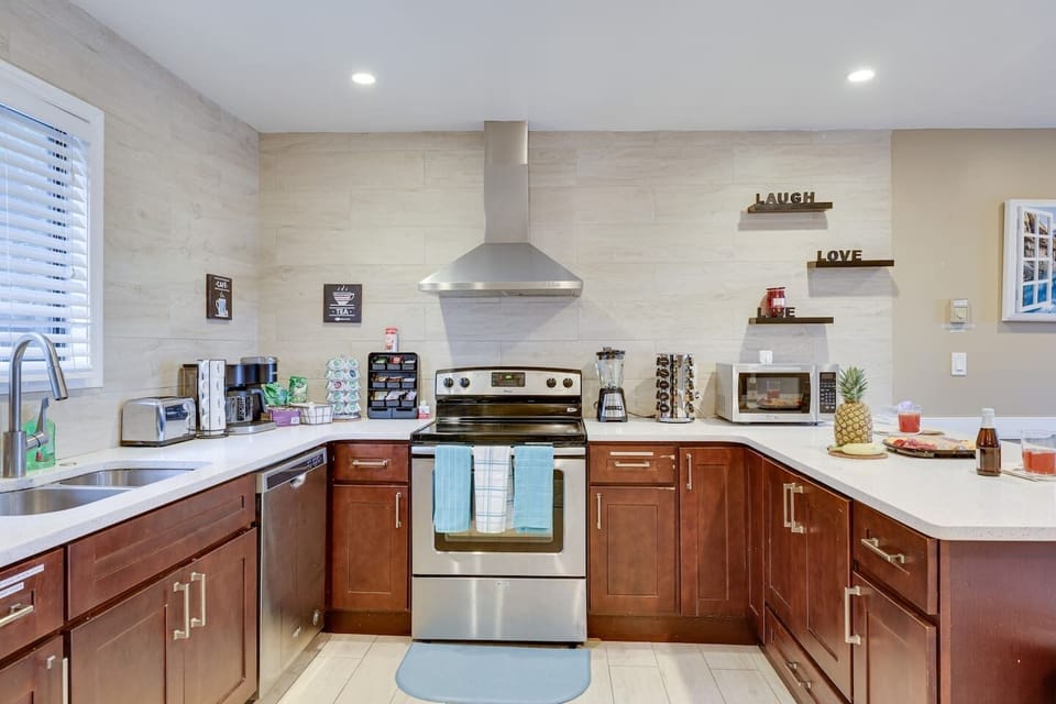 Fully stocked kitchen includes toaster oven, oven, blender, coffee machine, spice rack, hand towels, sink with dish soap and sponges, pots, pans, silverware, sharp knives trash can with bags.