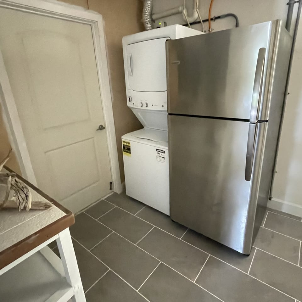 Ground floor has secondary laundry and second refrigerator 
