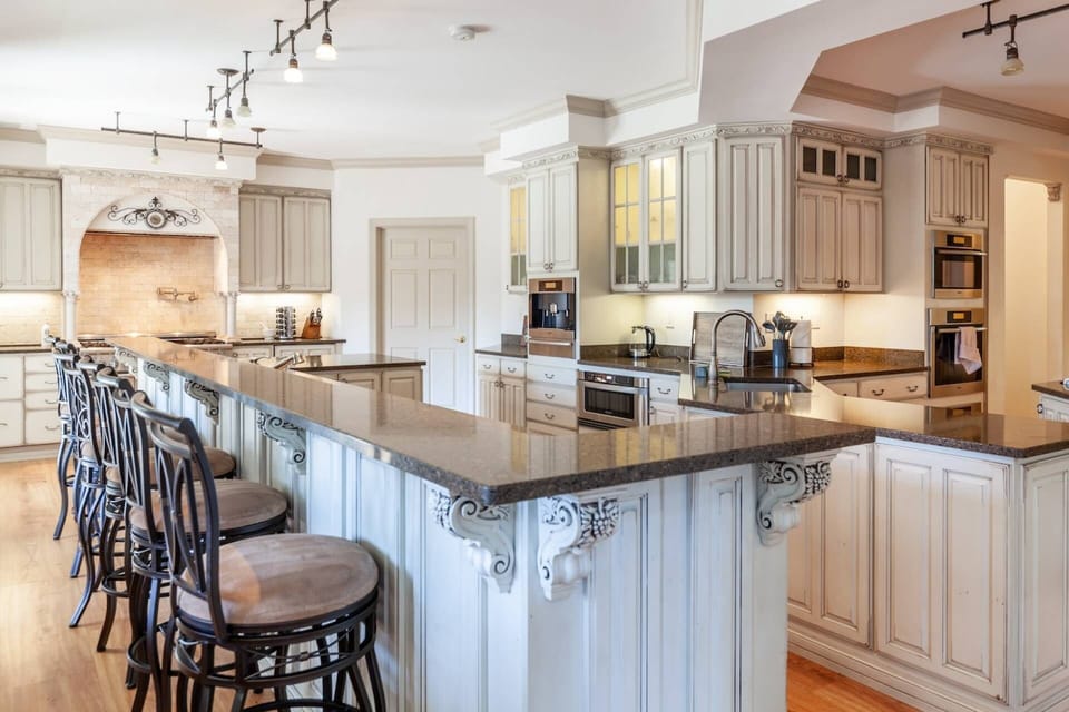 The double gourmet kitchen has more stainless appliances than you can count: multiple cooking stations, sinks, warming drawers and 2 dishwashers.