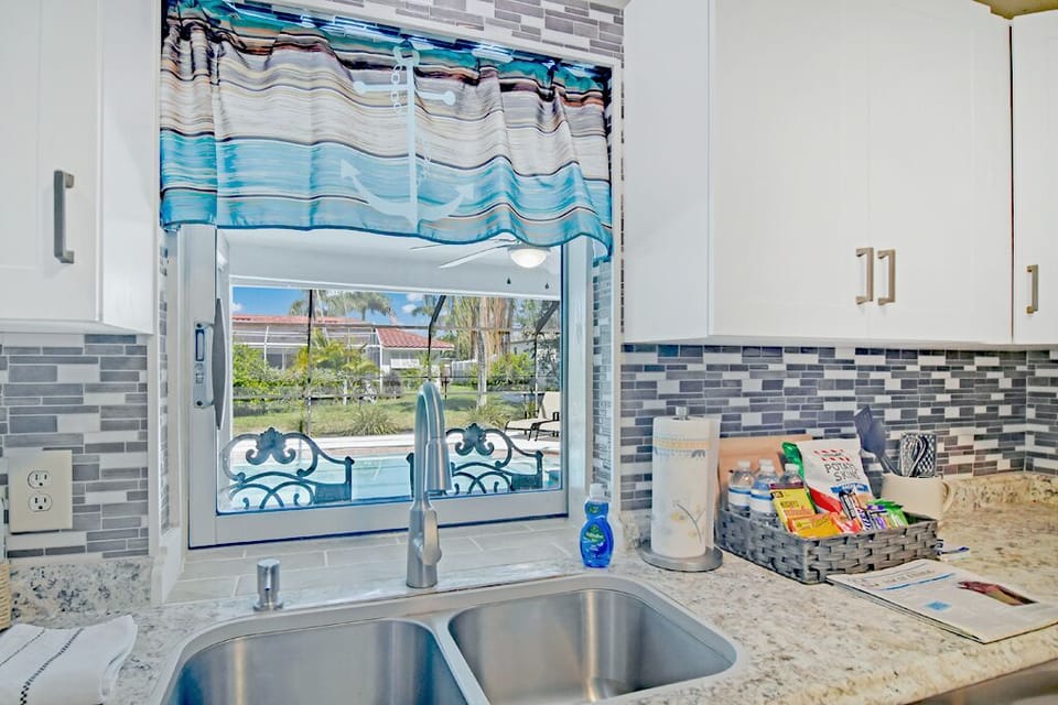 Nice view of the pool from the kitchen.  Snacks, and water for your arrival.  
