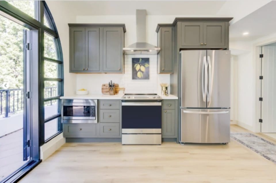 The kitchen has all stainless appliances with direct access to the balcony 