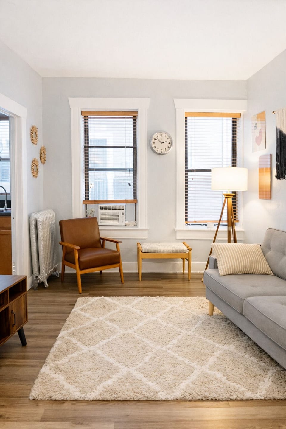 Large windows bring in plenty of natural light, making the living space feel open and welcoming