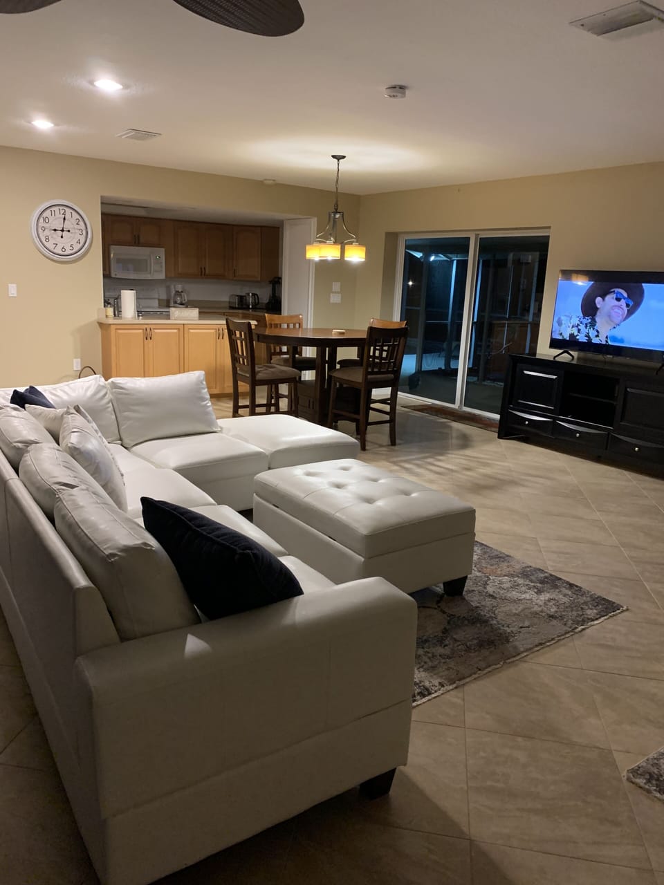 Living room sofa with TV and patio view
