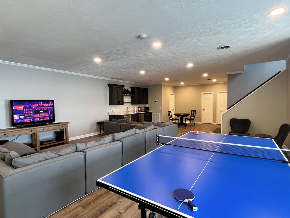 Downstairs family room/recreation room has wet bar with mini fridge, dishwasher.