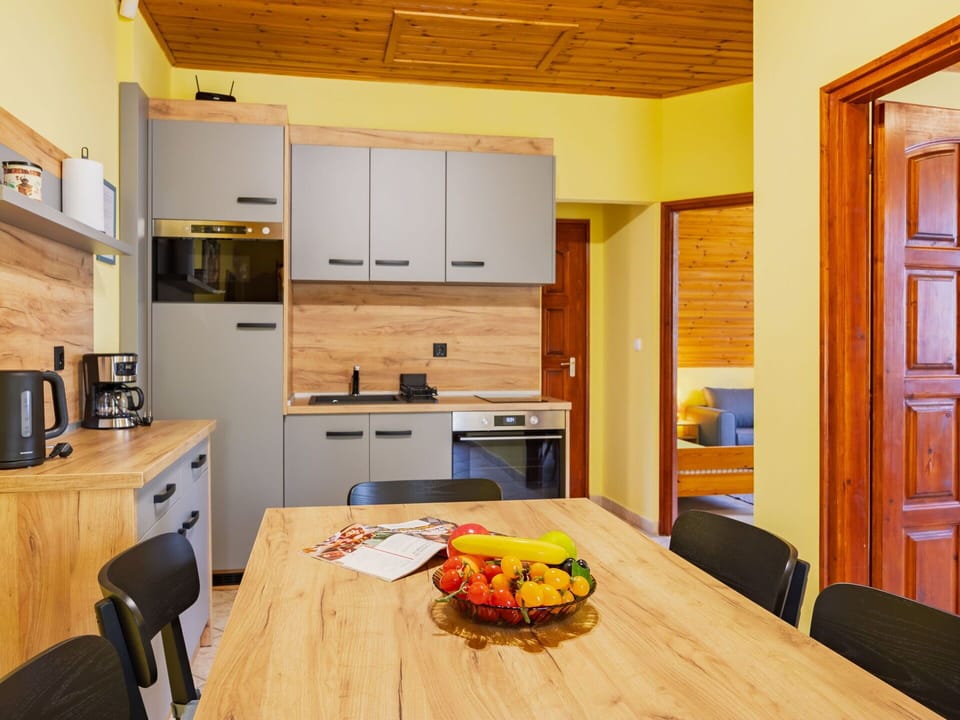 Interior Design, Furniture, Wood, Flooring, Floor, Ceiling, Countertop, Kitchen, Room, Cabinetry