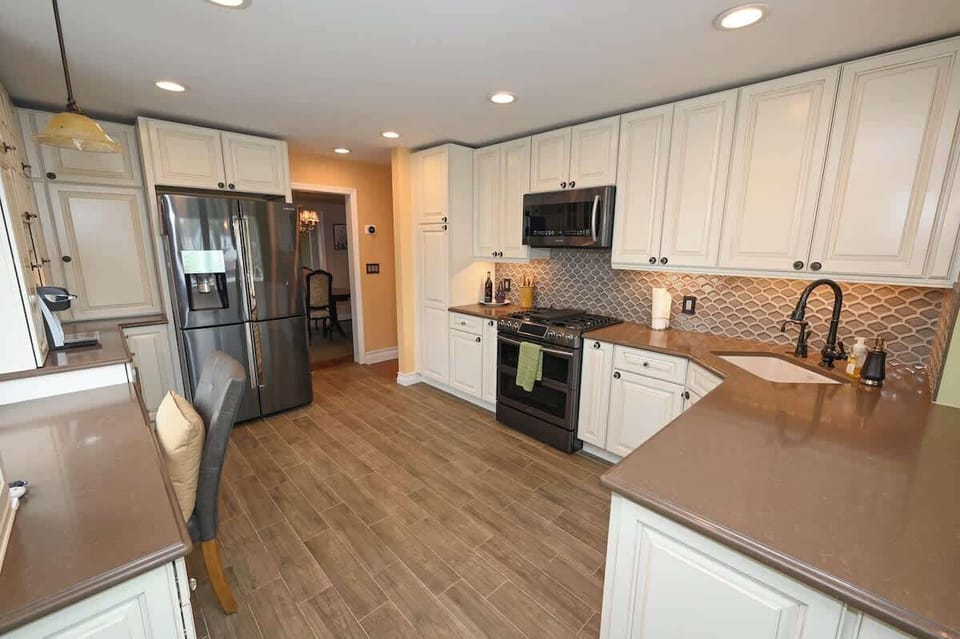 Brand new chefs kitchen with split oven, instant hot water, wine / beer fridge, coffee bar with keurig direct water line.