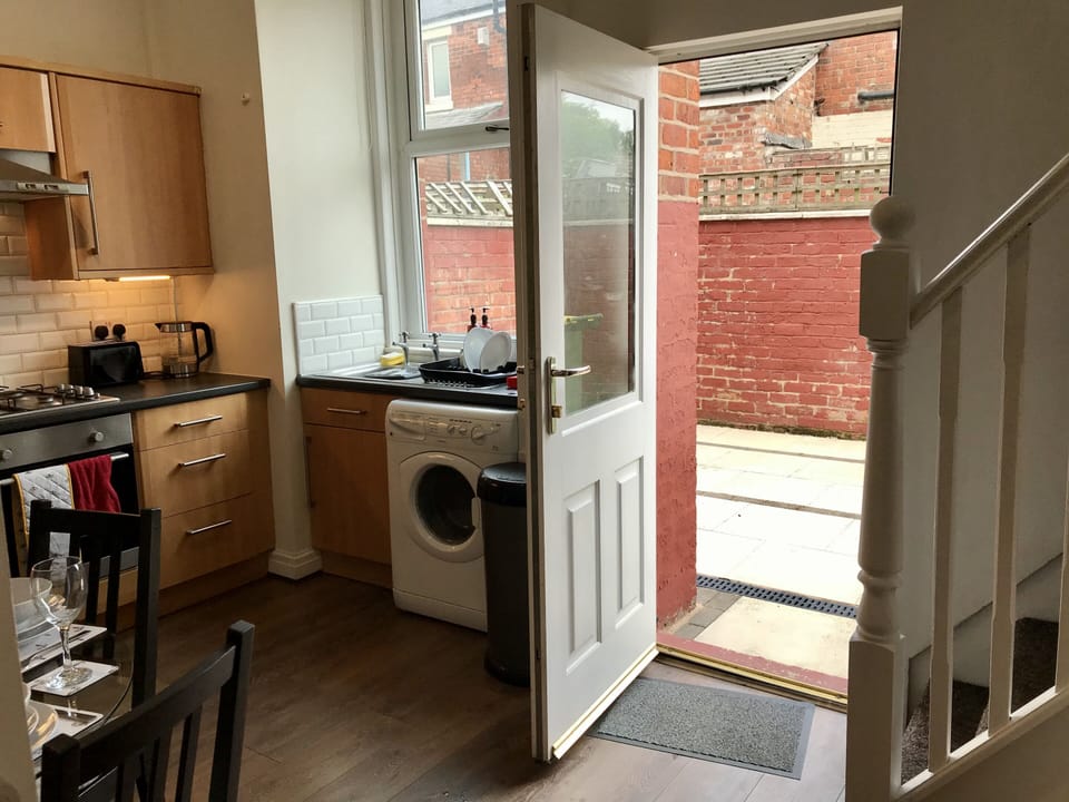 Kitchen - Spacious with washing machine facilities & access to private back yard