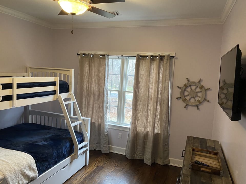 Queen bed (main) with 2 twin beds. Upper with a lower pullout trundle. 