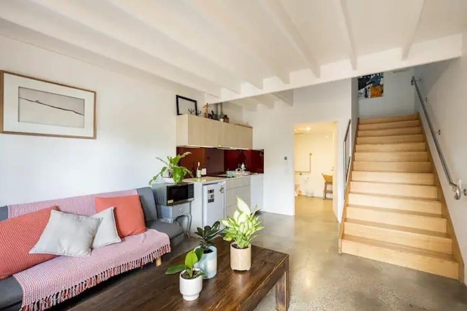Downstairs lounge kitchen area with a small double sofa bed