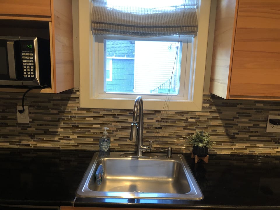 Fully loaded kitchen with appliances including microwave, Keurig & dishwasher. 
