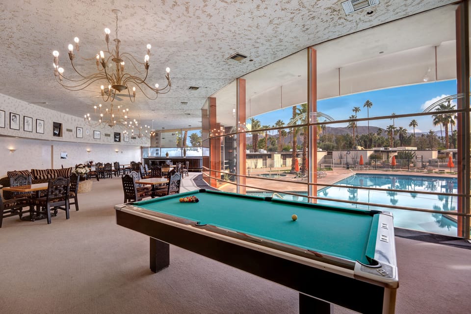 POOL TABLE OUT TO POOL AND MOUNTAINS