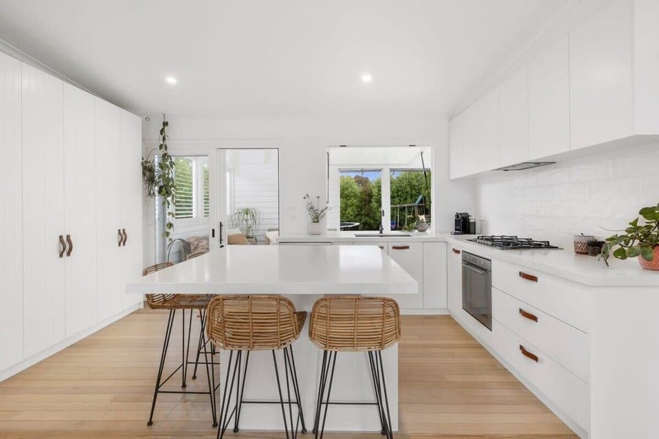 The oversized island bench in the kitchen is perfect for meal prep or casual dining