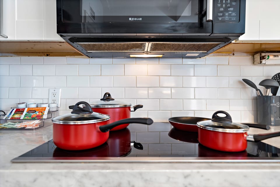 Microwave with built in vent above the cook top.