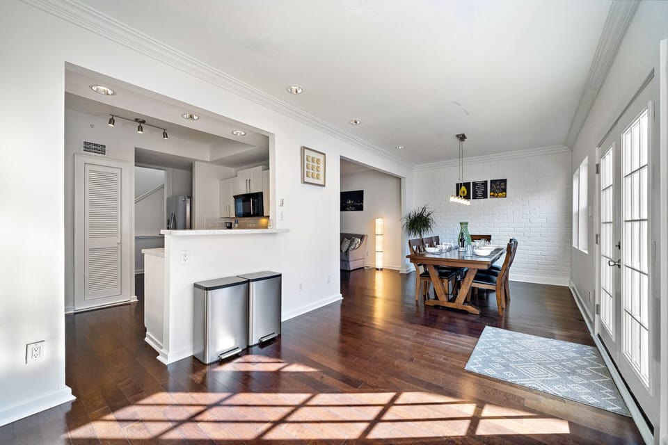 Large dining table w/seating for 8, open to the 2nd floor living room & kitchen.