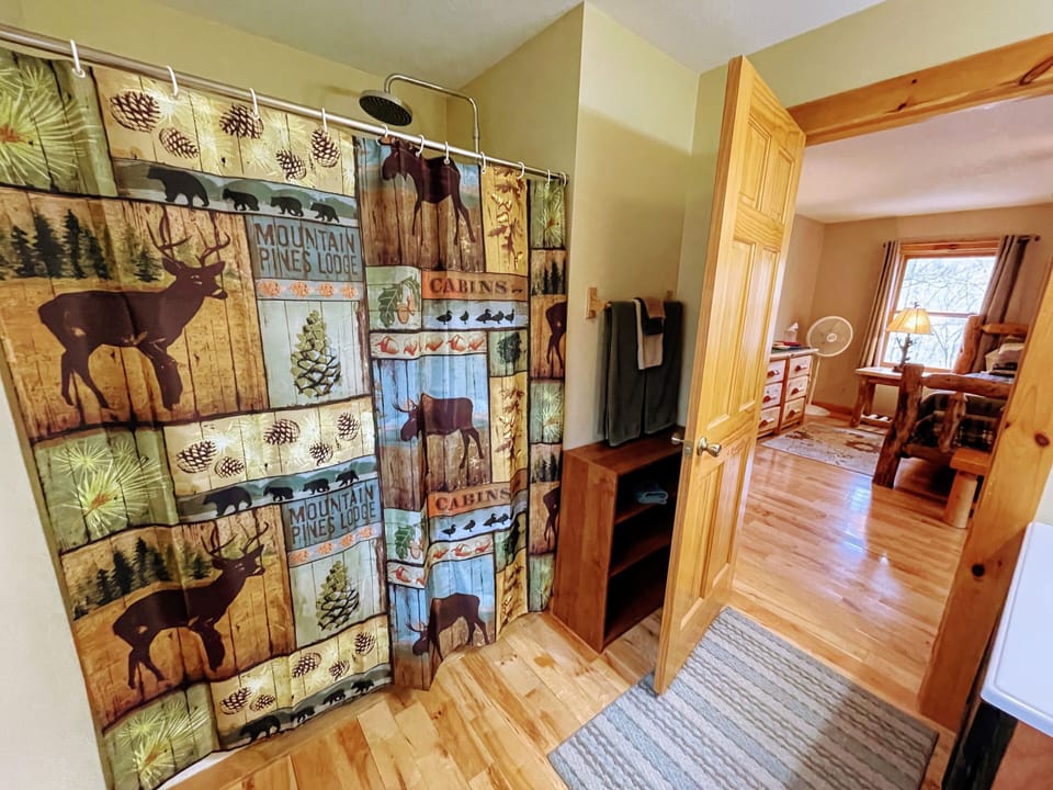 Owners Suite - full bath (upstairs) with rain shower. 