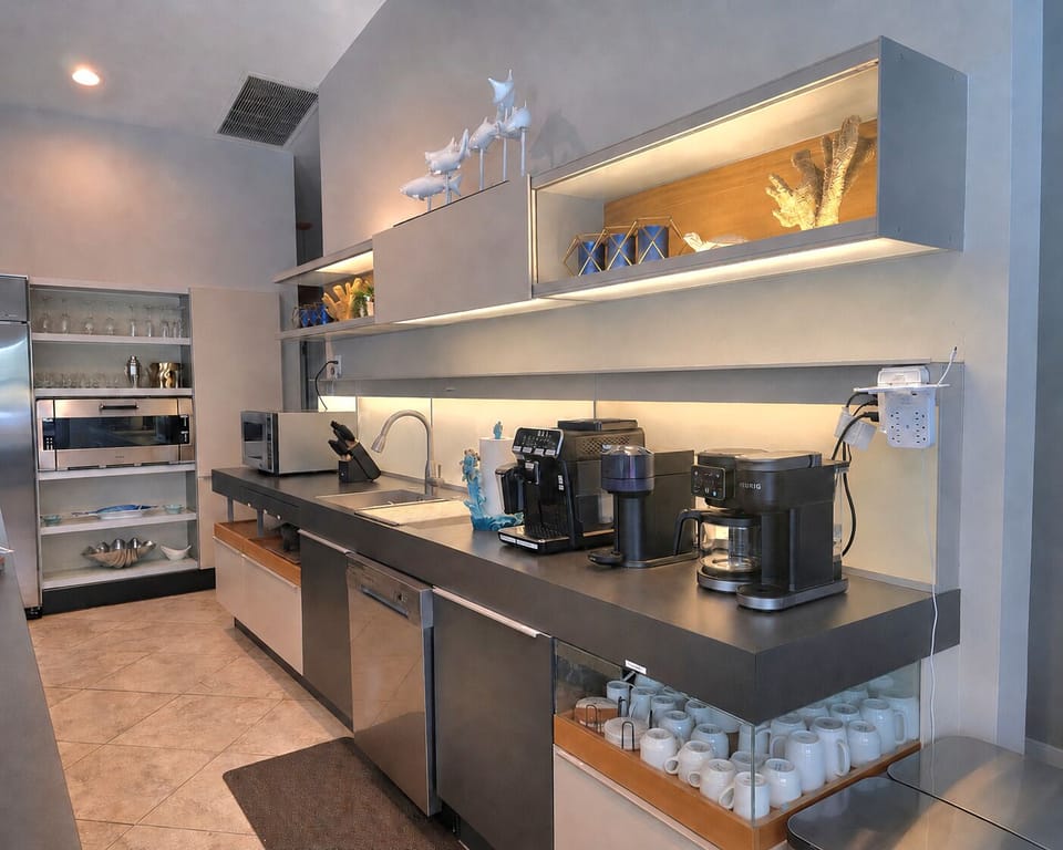 Thoughtfully designed workspace with premium appliances and coffee makers — perfect for morning brews or meal prep with ease