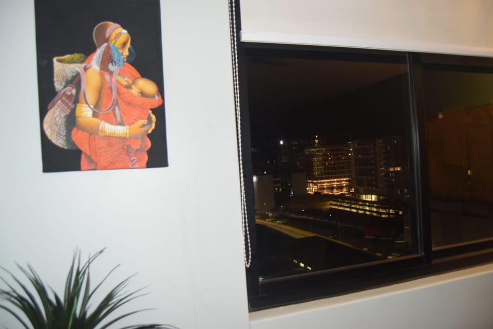 Modern Air Conditioned Living Room with African Furnishing and Night City View