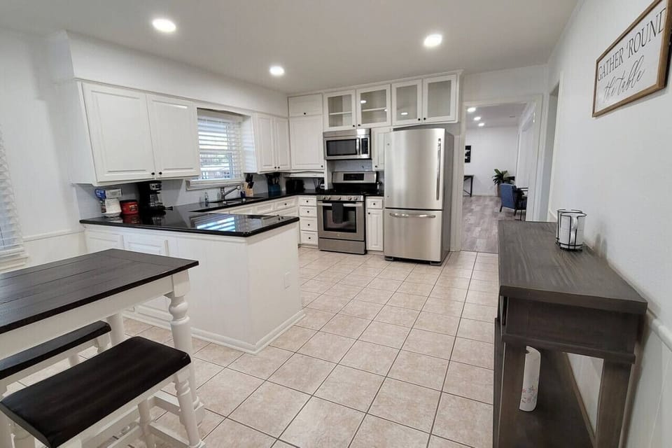 The kitchen is well-equipped with starter condiments. There is a breakfast bar area separate from the dining area, and complementary coffee is provided for your morning start.