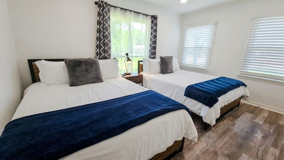 The second bedroom features a spacious and inviting queen-size bed for your comfort.