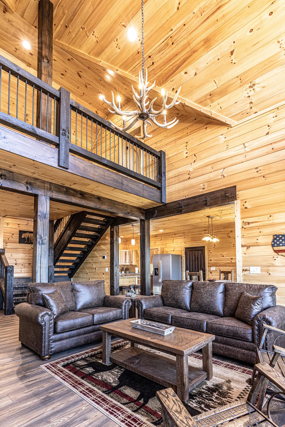 The cozy living room also includes a queen sized sofa pullout.