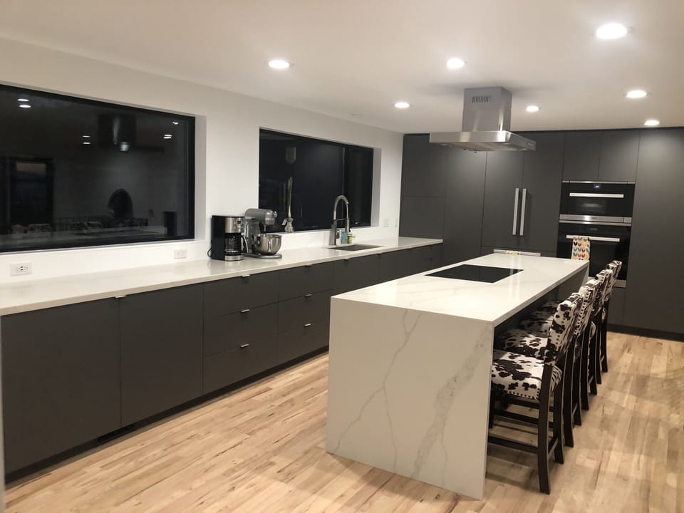 Large kitchen + counter space + waterfall countertop