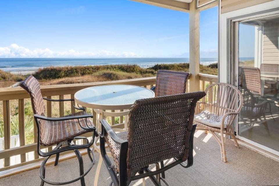 Sit outside and relax on this ocean front balcony and listen to the waves.