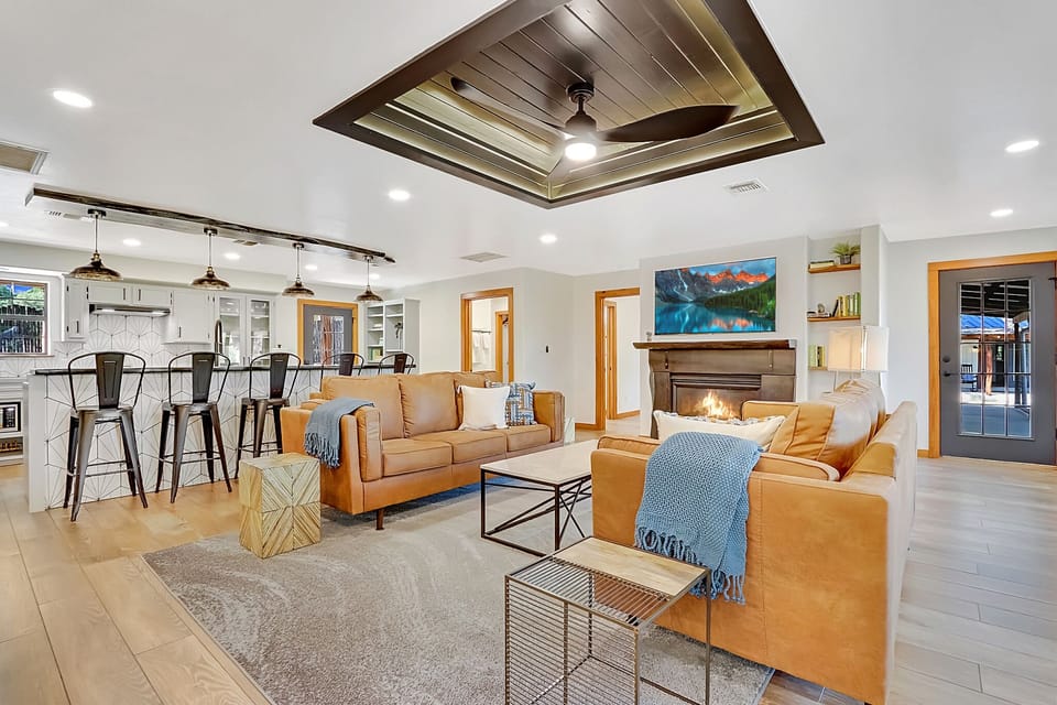 Flat screen television and fireplace in living room.