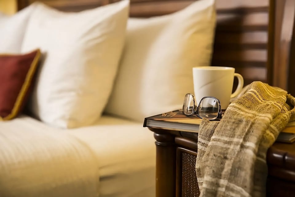 Settle in with a warm drink and bedside essentials nearby.