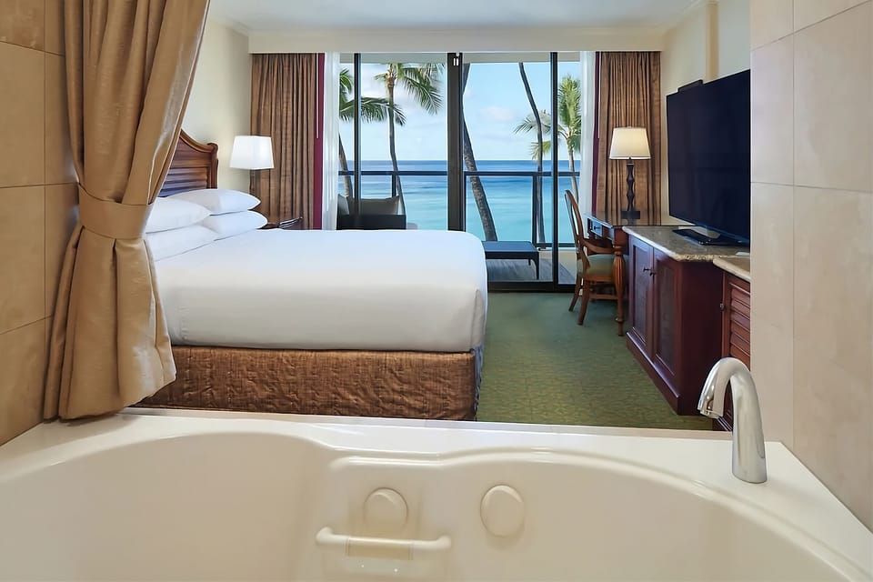 Soak in the tub while enjoying calming ocean views.