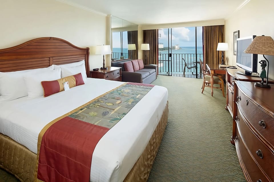 Stretch out on crisp linens and watch waves beyond.