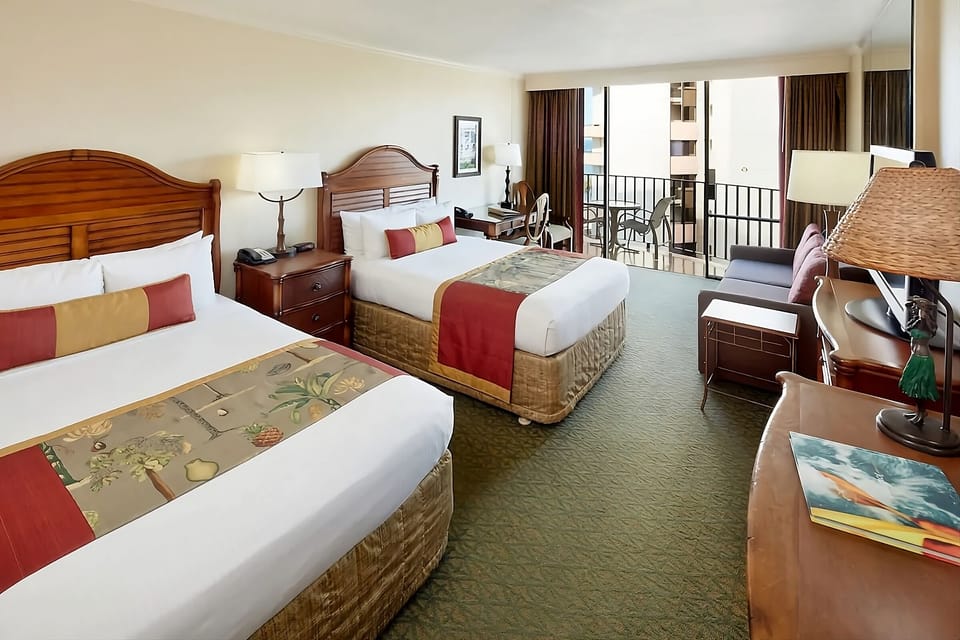Settle into crisp beds with breezy balcony access