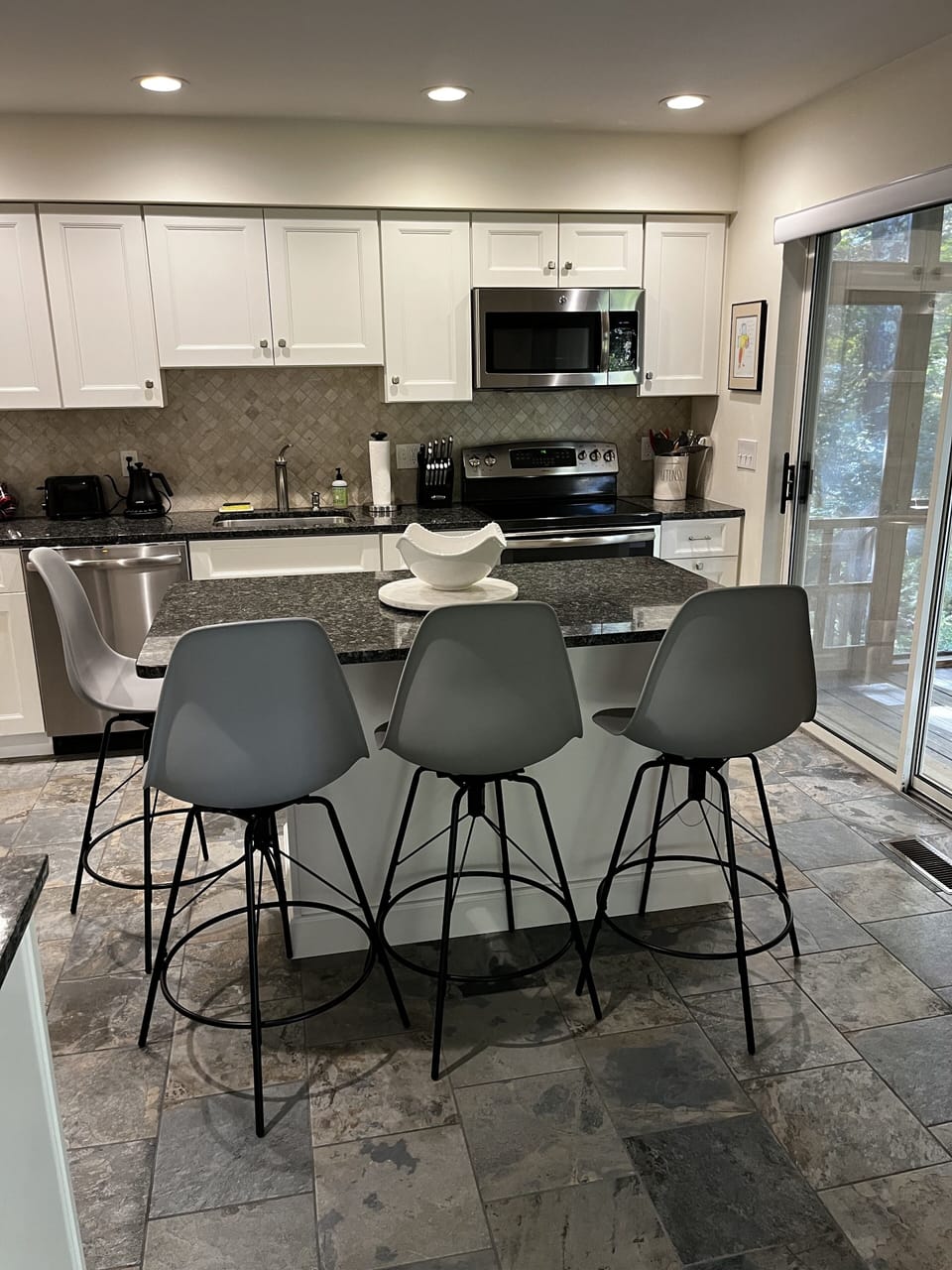 Kitchen with island and bar stools