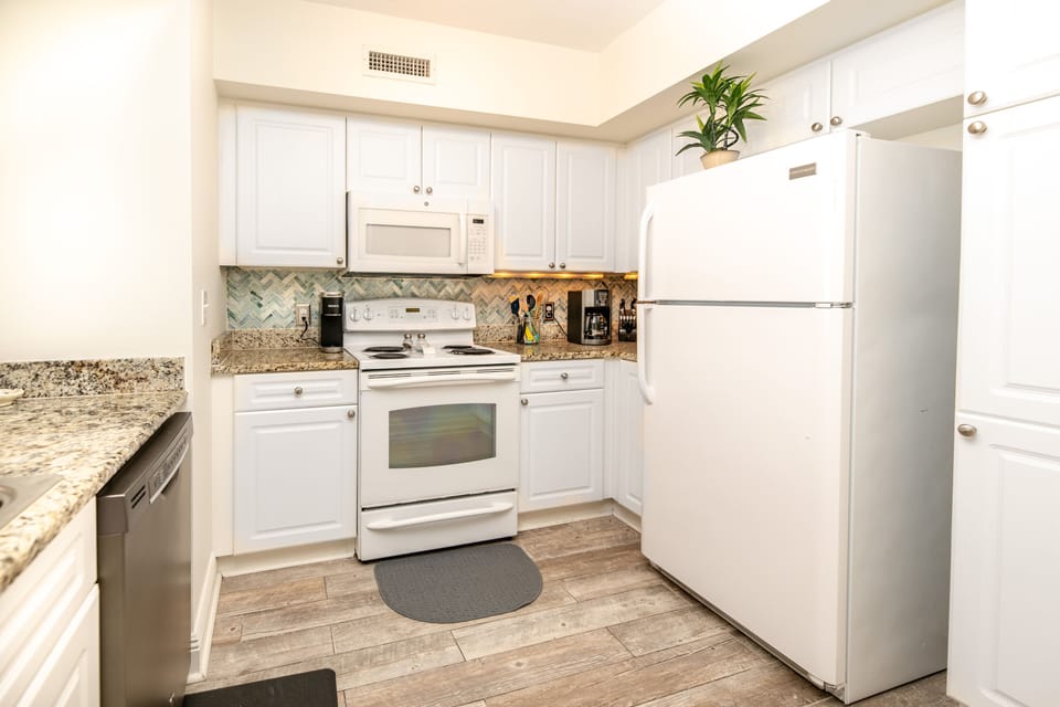 Fully stocked kitchen with Keurig and drip coffee makers.