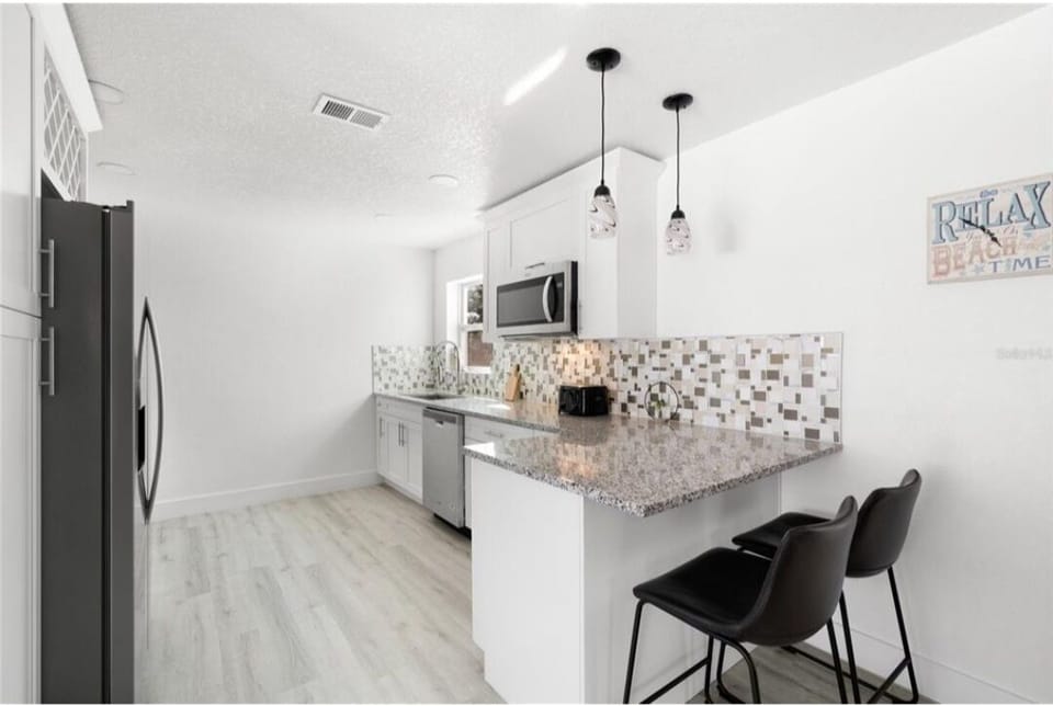 Spacious kitchen stocked with all your cooking and entertaining needs