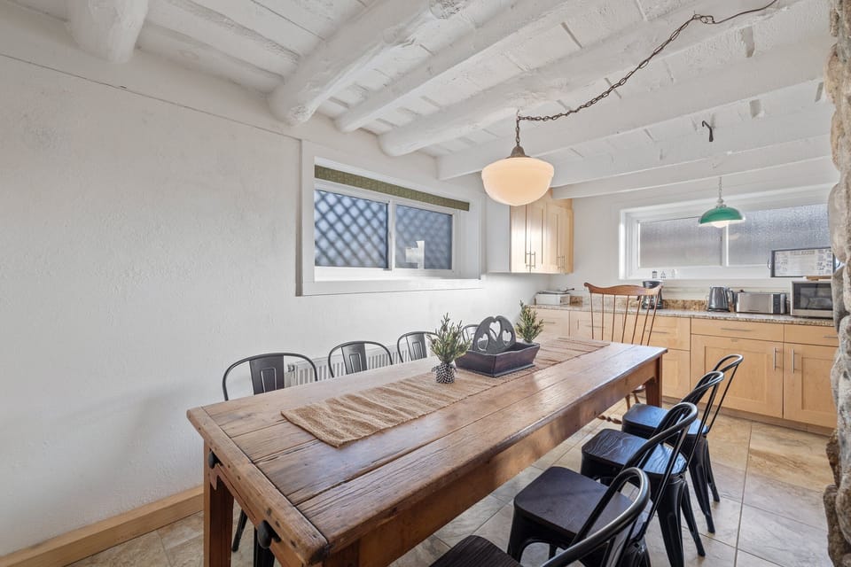 Kitchen with antique farm table large enough for 10