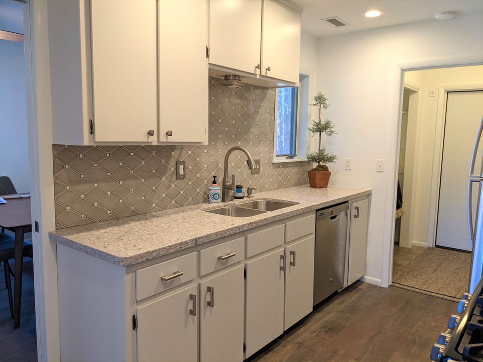 A spacious galley kitchen has all the kitchen basics. 