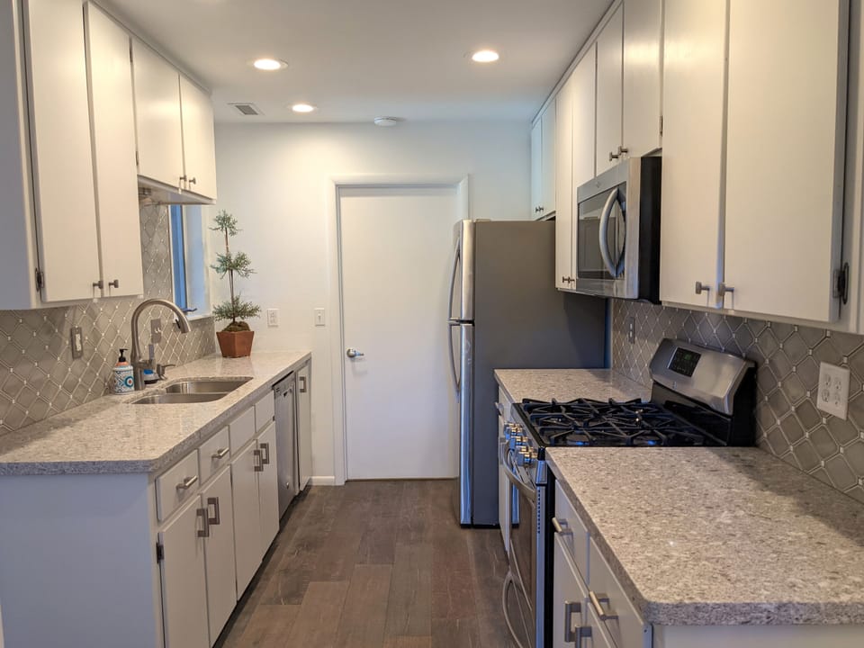 The kitchen has direct access from the garage. 