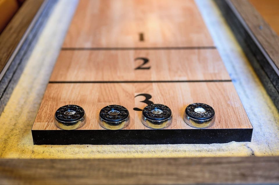 Challenge your friends and family to a fun game of shuffleboard in our cozy cabin-perfect for game nights, group gatherings, and creating unforgettable memories during your stay!