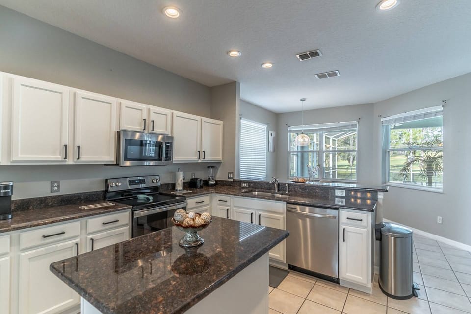 Newly Renovated Kitchen with updated countertops and stainless steel appliances
