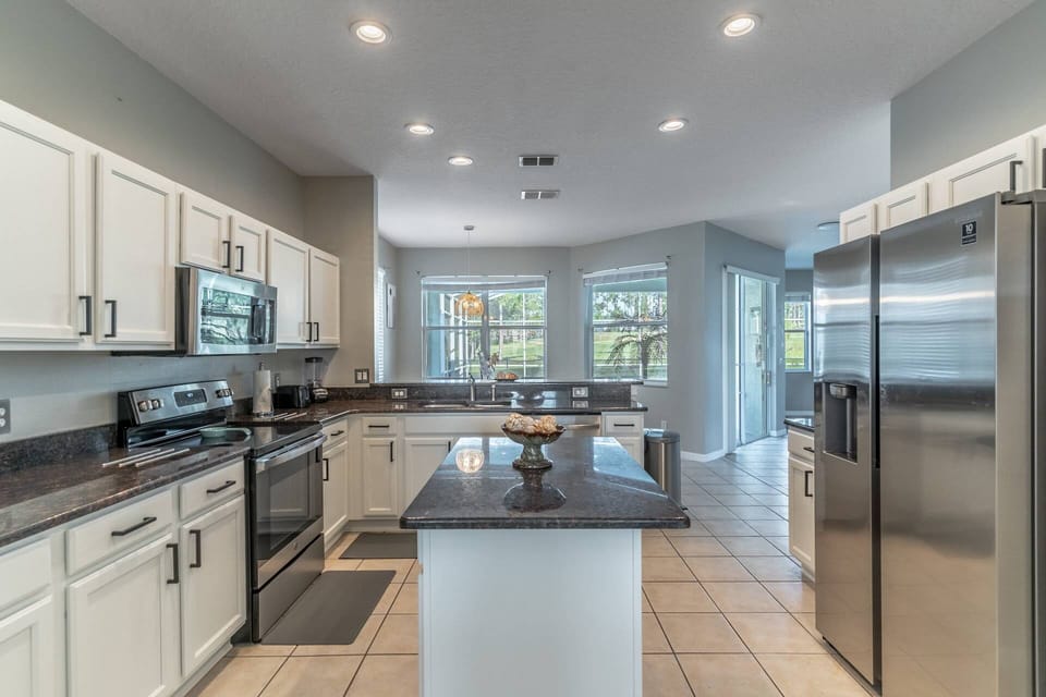 Newly Renovated Kitchen with updated countertops and stainless steel appliances