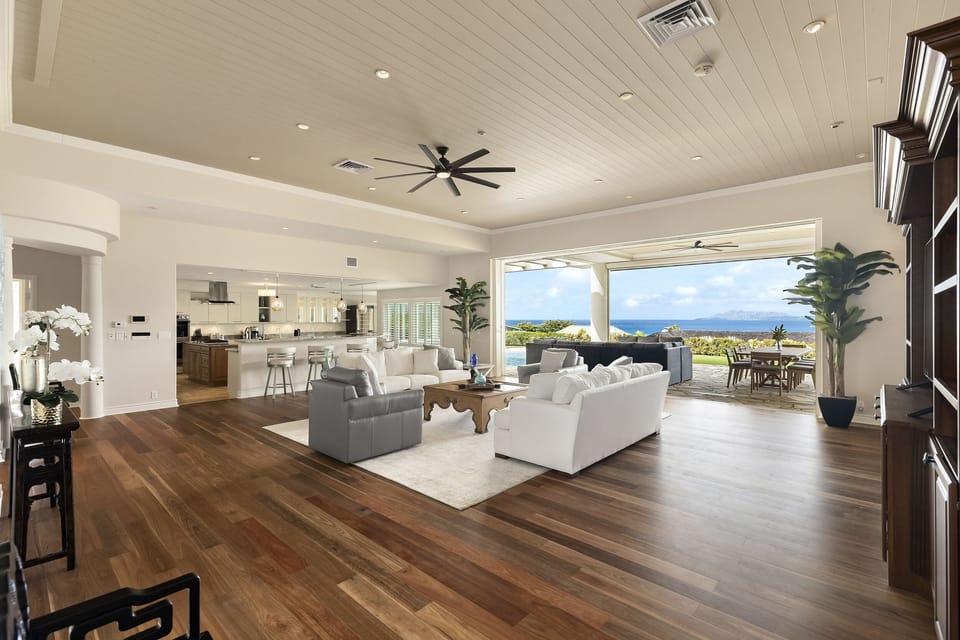 Perfect for gathering—soaring ceilings and open flow to kitchen and dining.