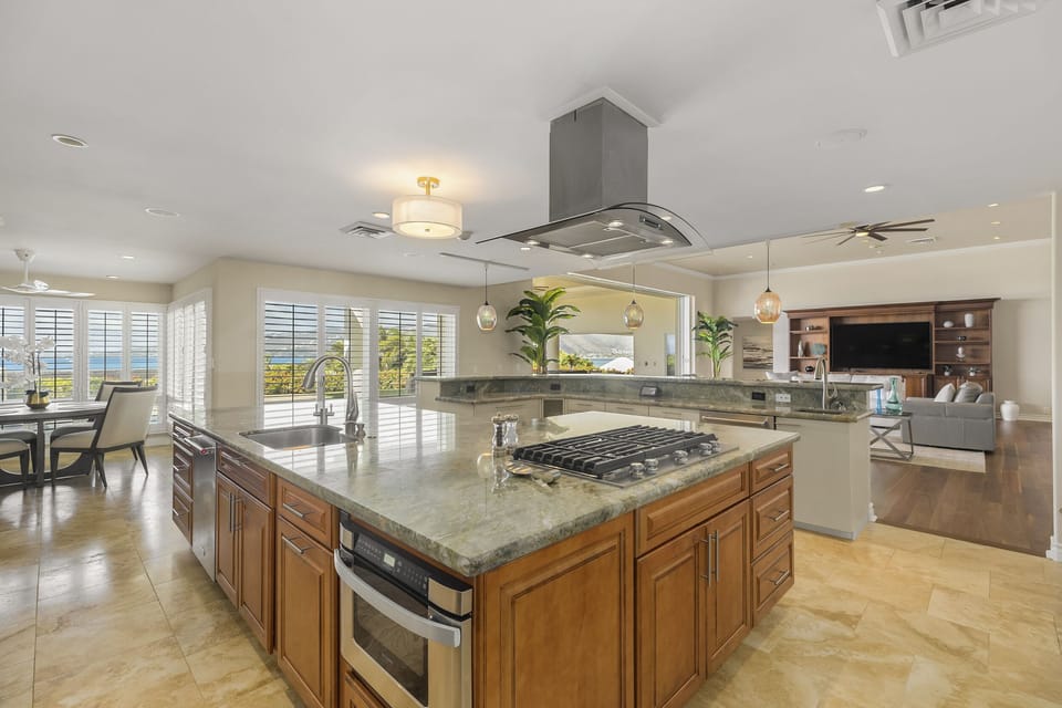 Top-tier appliances and expansive counters make dining at home effortless.