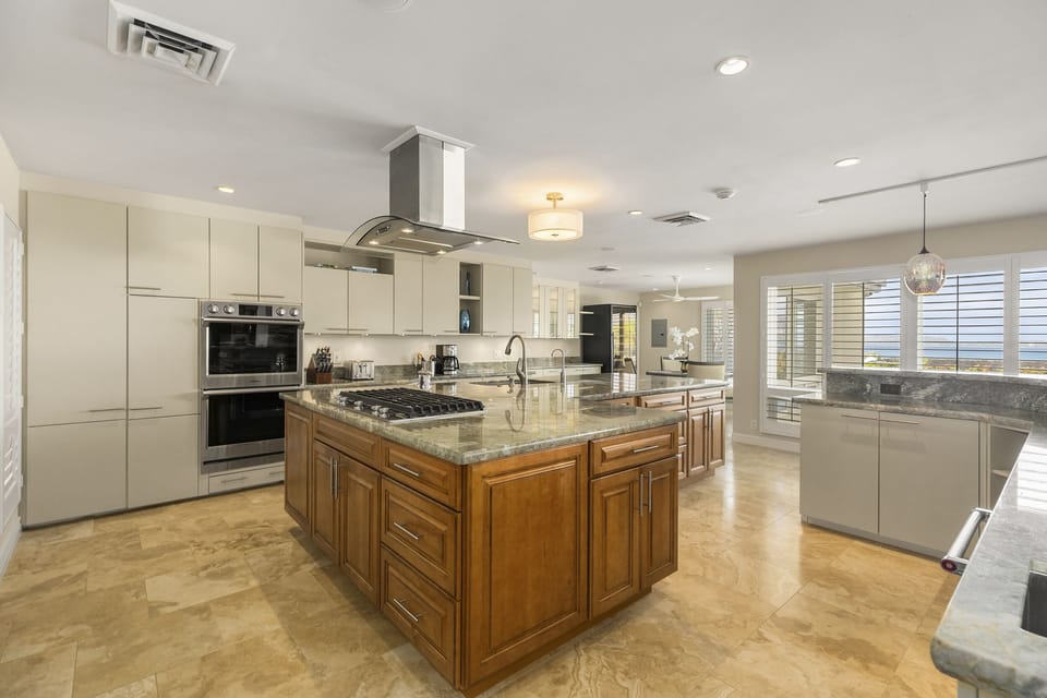 Cook with ease in this chef-inspired kitchen featuring a central island.